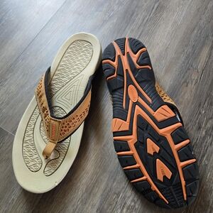 Tan and Black Flip Flops with Orange Accents